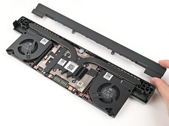 Use your fingers to lift the cover off the Graphics Module and remove it.
