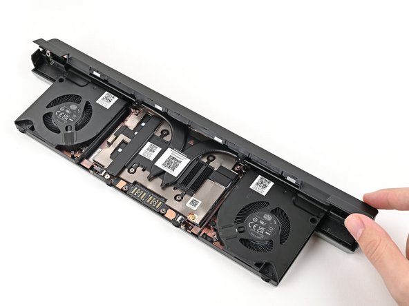 Use your fingers to lift the cover off the Graphics Module and remove it.