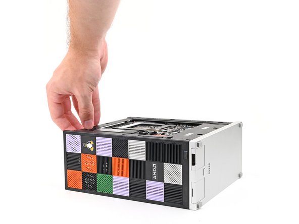 Rotate the Desktop onto its right side so the Mainboard is facing upward.