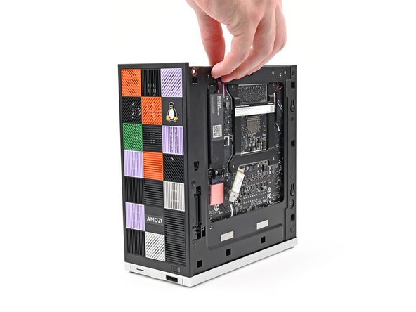 Rotate the Desktop onto its right side so the Mainboard is facing upward.