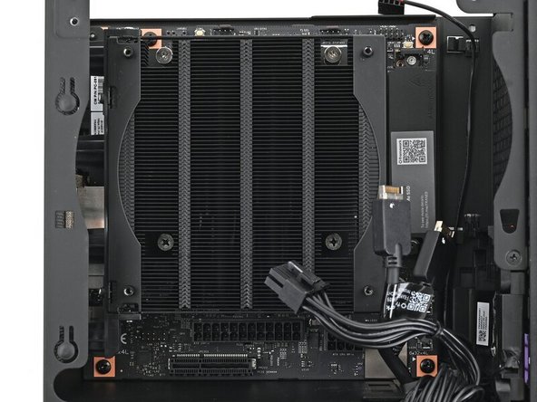 Use your Framework Desktop Screwdriver to remove the four 8.2 mm‑long Phillips screws securing the Mainboard.