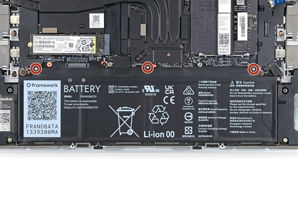 Use your Framework Screwdriver to tighten the three captive T5 Torx screws securing the battery.
