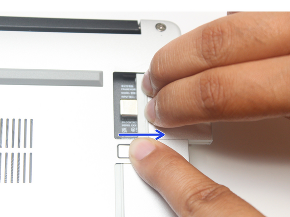 Close your laptop completely and turn it over so you can access the Expansion Cards.