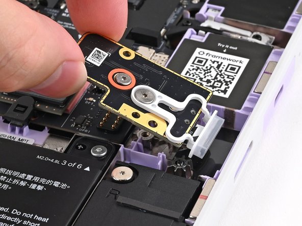 Use your fingers to lay the Fingerprint Reader in place.