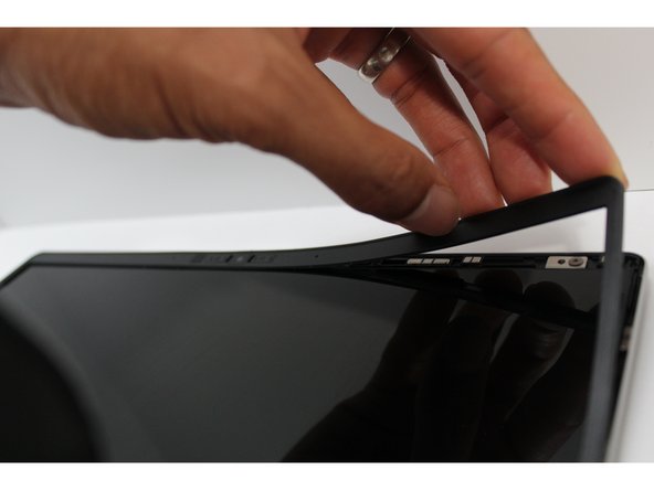 Open the Framework Laptop 180 degrees to attach the Bezel.  Make sure the fasteners in the top left and right corners of the Bottom Cover aren't interfering with the opening.