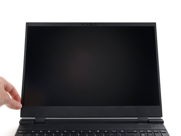 Lift the bezel around the perimeter of the screen until all of its magnets are released.