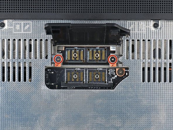 Use your Framework Screwdriver to tighten the two captive T5 Torx screws securing the Expansion Bay Module.