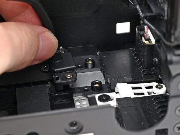 Insert the the Expansion Card cable into its slot and align it over its two screw pegs.