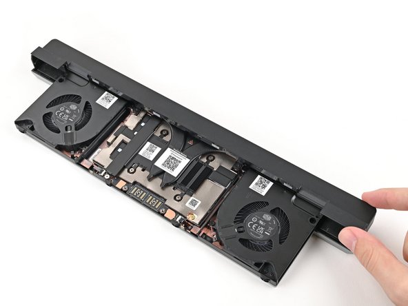 Use your fingers to lift the cover off the Graphics Module and remove it.