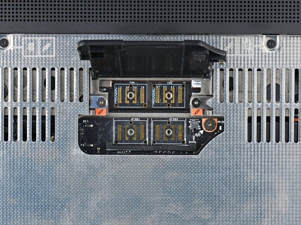 Use your Framework Screwdriver to tighten the two captive T5 Torx screws securing the Expansion Bay Module.