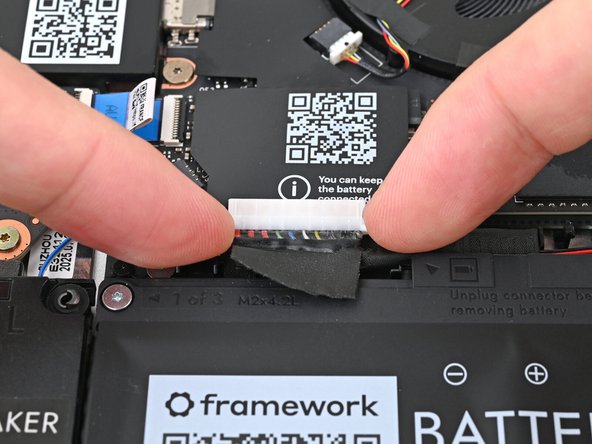 Use your fingers to grip the edges of the Battery connector and slide it straight out of its socket to disconnect the Battery.