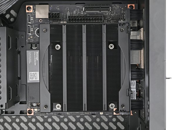 Use your Framework Desktop Screwdriver to install the four 8.2 mm‑long Phillips screws securing the Mainboard.