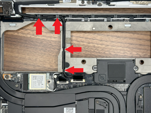 Route the eDP Cable (Display) from the Display through the left hinge placing it in the rear guided channel.