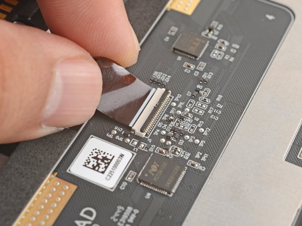 Use your finger to flip down and gently press the locking tab in place.