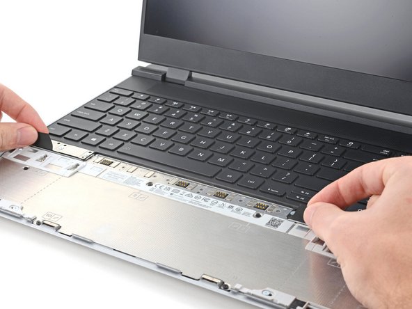 The Keyboard is held in place with strong magnets. Apply gradually increasing force to avoid having the Keyboard violently eject.