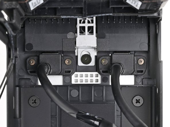 Use your Framework Desktop Screwdriver to install the four captive T5 Torx screws securing the two Expansion Card cables.