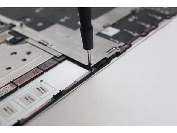 Screw all the black fasteners into place in the silver bracket.