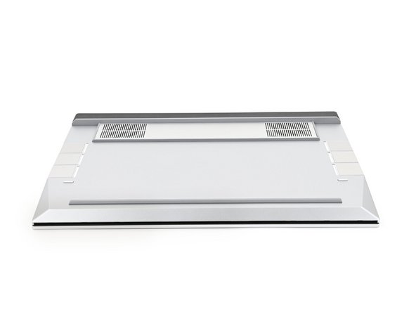 Close the laptop and flip it over.