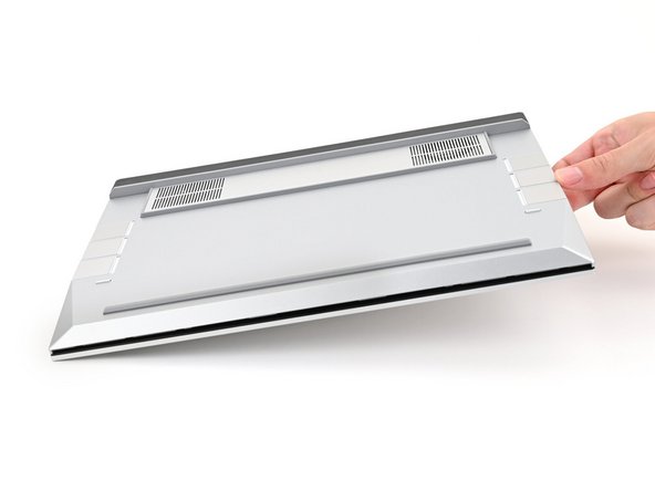 Close the laptop and flip it over.