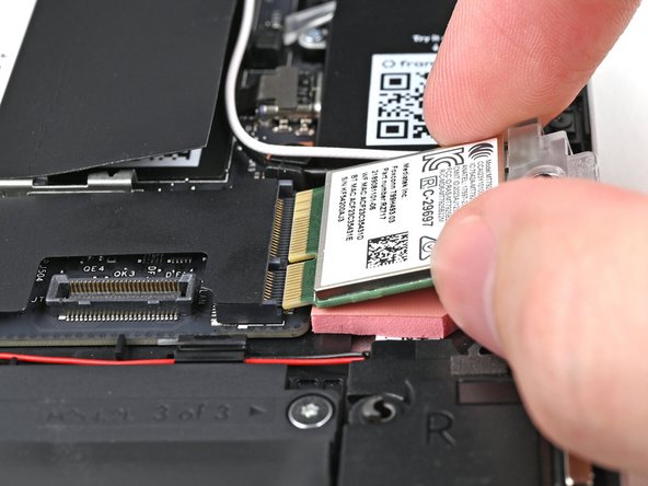 Don't pull the module too far from its socket, as it's still connected by two cables.