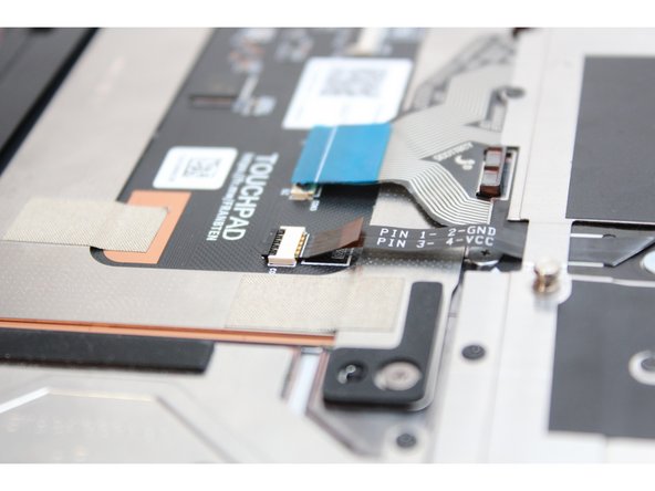 Flip the black latch down to secure the cable