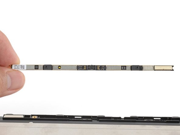 Peel off any protective liners covering the camera lens on the replacement webcam. 