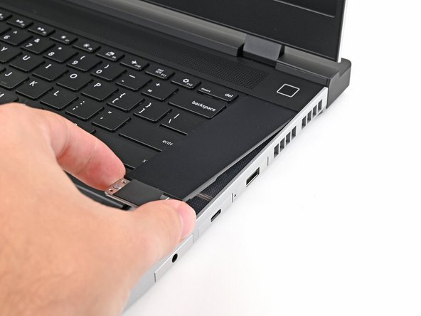 Hold the Input Module at a slight downward angle and align it with one of the dotted lines on the Mid Plate.