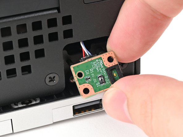 Use your finger to pull the Power Button Board off its alignment peg.