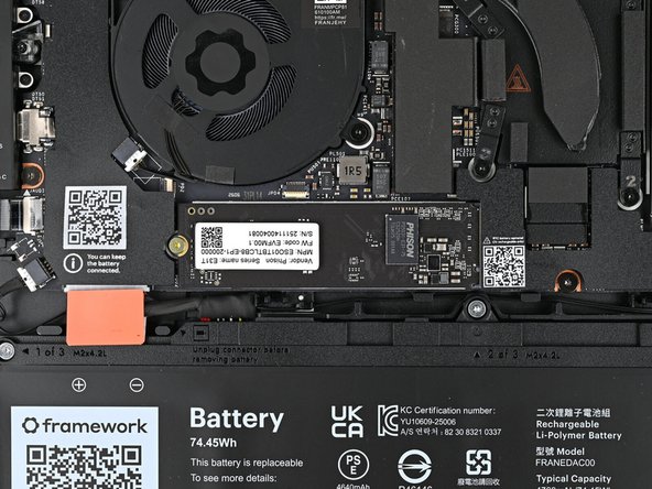 The SSD might pop up at a shallow angle when you remove the screw.