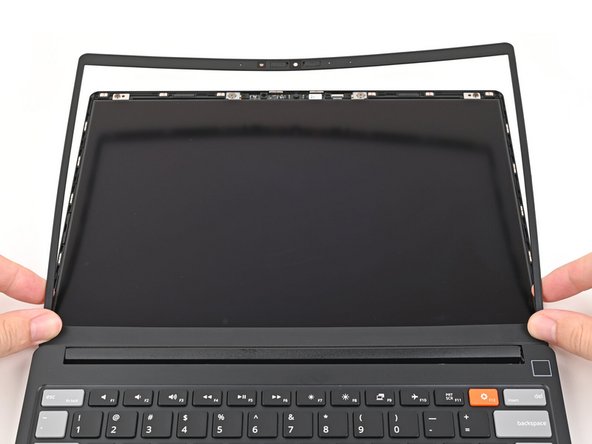 Align the bottom edge of the Bezel with the top edge of the Input Cover and press down so the Bezel covers the hinges and cables.