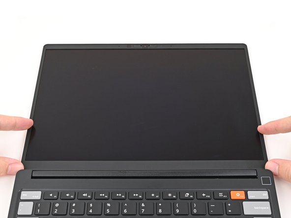 The bottom edge of the Bezel should sit flat and the magnets at its edges should "snap" into place.