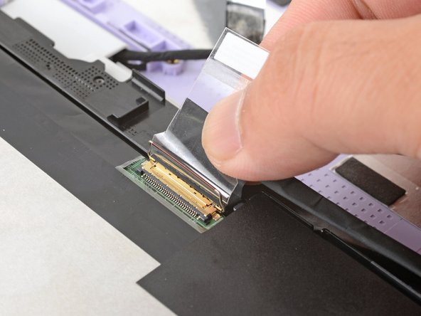 Make sure the locking bar doesn't fall back in place while you disconnect the display cable.