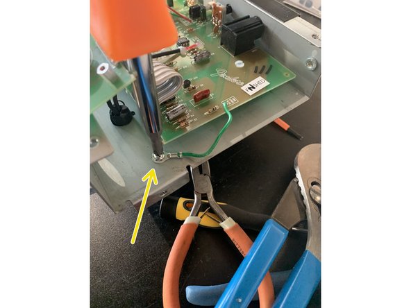 Pull gently on the board to make sure that it is not stuck to any of the standoffs that were holding the circuit board screws.