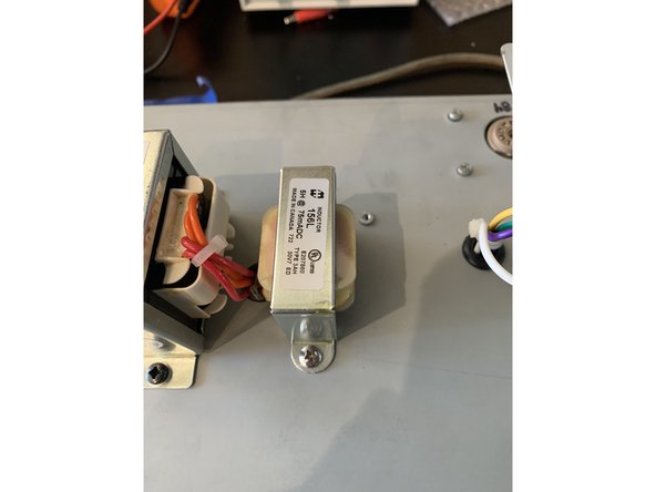 Carefully mark and drill 3/16" holes for mounting the choke next to the inlet grommet for the power transformer.
