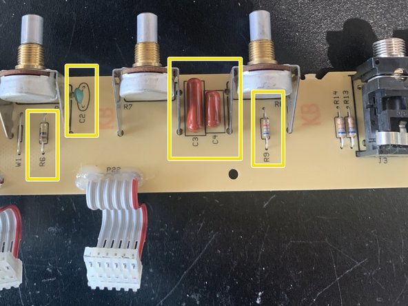 Remove the knobs, nuts, and washers from the front of the amp