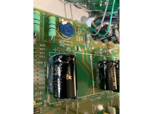 Use  silicone to glue all filter caps to  board as well as the wire for the  reverb. You can omit this step if you want, but securing the  caps will make your amp sturdier and keep any components from shaking loose