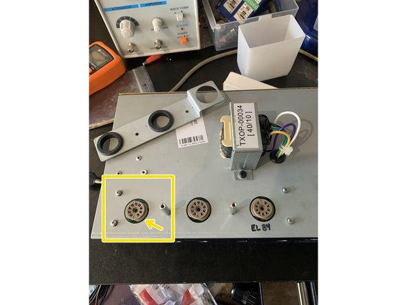 Turn the amp over so the tube sockets are facing you