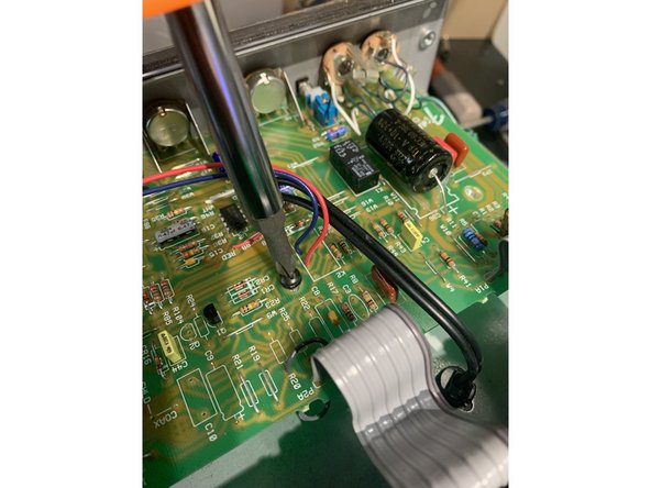 Remove all PCB standoff screws and the solder terminal screw connecting the green ground wire from the Main Pcb near the input jacks to the  chassis.