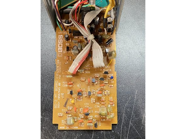 Expose the top side of the circuit board and find the parts that need to be removed - and start removing them!
