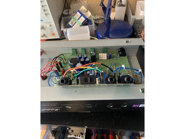 Remove the two red and one black speaker and headphone jack nuts