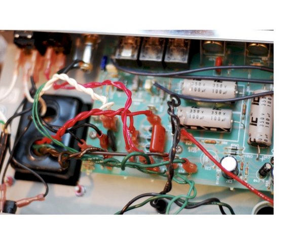 Re-install the small PCB that holds the tubes. Make sure all the ribbon cables have a smooth path with no kinks or sharp turns in the cable