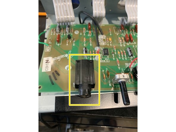 Remove  input  jack. This part is snapped into the PCB and then  soldered. I find it's  easiest  to remove the solder  from  the back side first and then remove the  jack