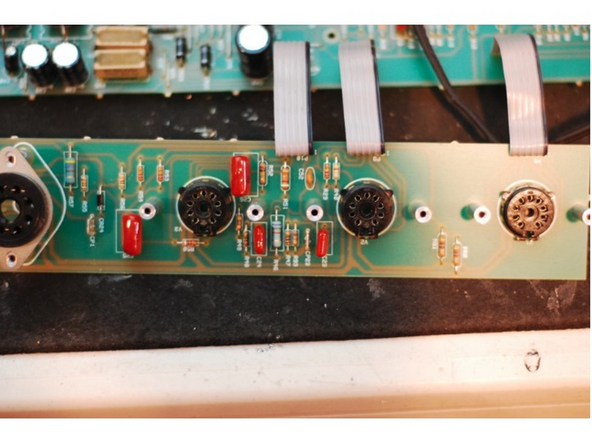 Remove the smaller tube PCB that supports the tube sockets: Remove the tubes and then remove the small black screws that hold both the larger tube PCB and the smaller V1 tube PCB to the chassis. Gently lift both tube PCBs free of the chassis