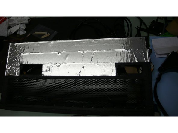 Install the shielding tape on the back panel as indicated. The tape cuts easily with scissors or an exacto knife.