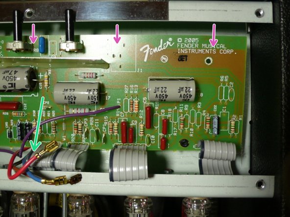 Pull gently on the board to make sure that it is not stuck to any of the standoffs that were holding the circuit board screws.