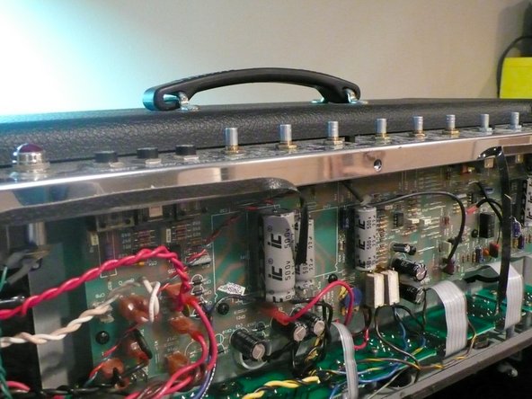 Unplug the amp and place on a level surface