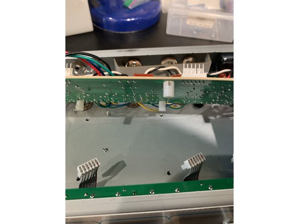 Disconnect the grounding lug  screw near the pilot light.