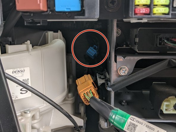 Locate the 8-pin GPS connector at the back left of the fuse box