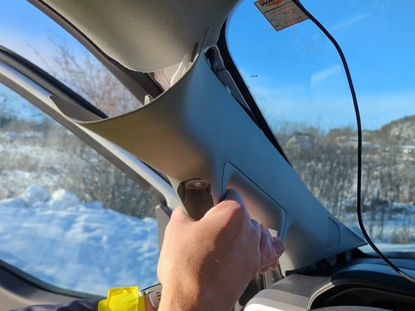 Remove the covers on the A-pillar so you can route the cable underneath.