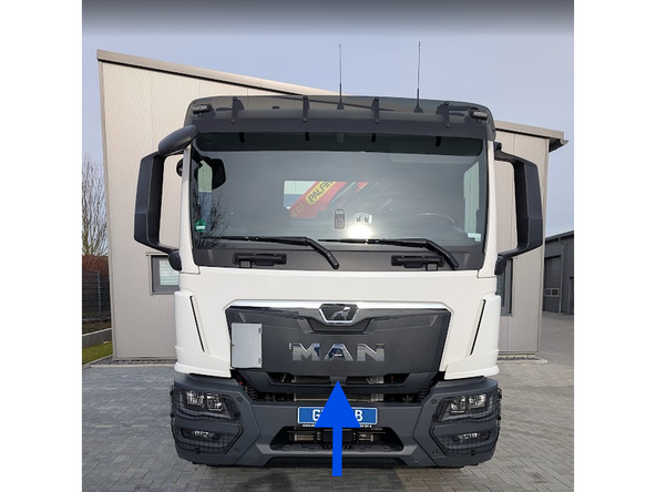 Open the engine compartment. To unlock it, locate the lever in the center of the truck and pull it gently.
